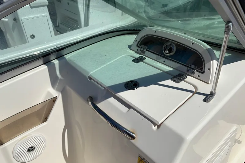 Slide: The Image of Interior view of a 2012 Pioneer 197 Venture boat dashboard and controls. - 22