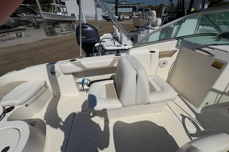 Slide: The Image of Interior of a 2012 Pioneer 197 Venture boat with seating and Yamaha engine. - 24