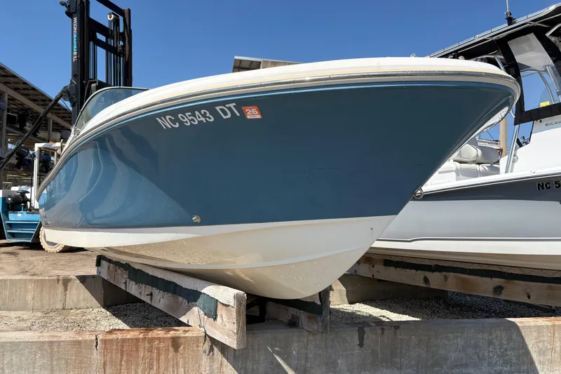 Slide: The Image of 2012 Pioneer 197 Venture boat on dry dock, blue hull, registration NC 9543 DT. - 4