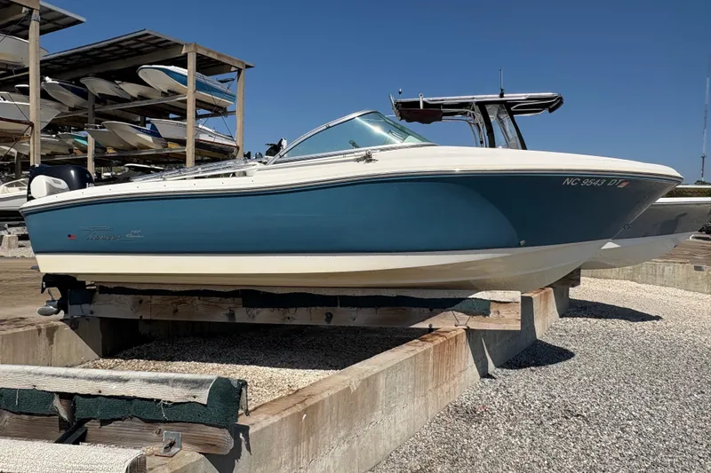 Slide: The Image of 2012 Pioneer 197 Venture boat on dry dock under clear blue sky. - 6