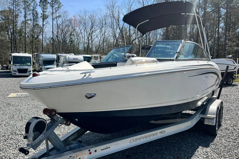 The Image of 2016 Chaparral 21 H2O Sport boat on trailer in outdoor setting. - 1