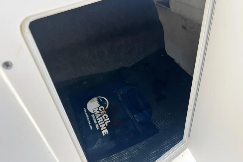 Slide: The Image of Storage compartment of a 2016 Chaparral 21 H2O Sport boat with Cecil Marine bag. - 12