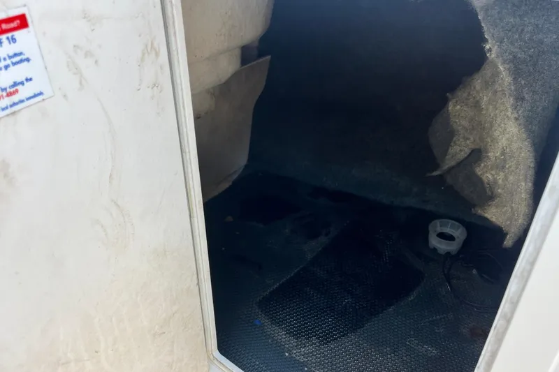 Slide: The Image of Interior storage compartment of a 2016 Chaparral 21 H2O Sport boat. - 13