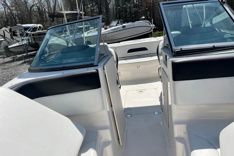 Slide: The Image of 2016 Chaparral 21 H2O Sport boat interior with open cockpit and seating. - 16