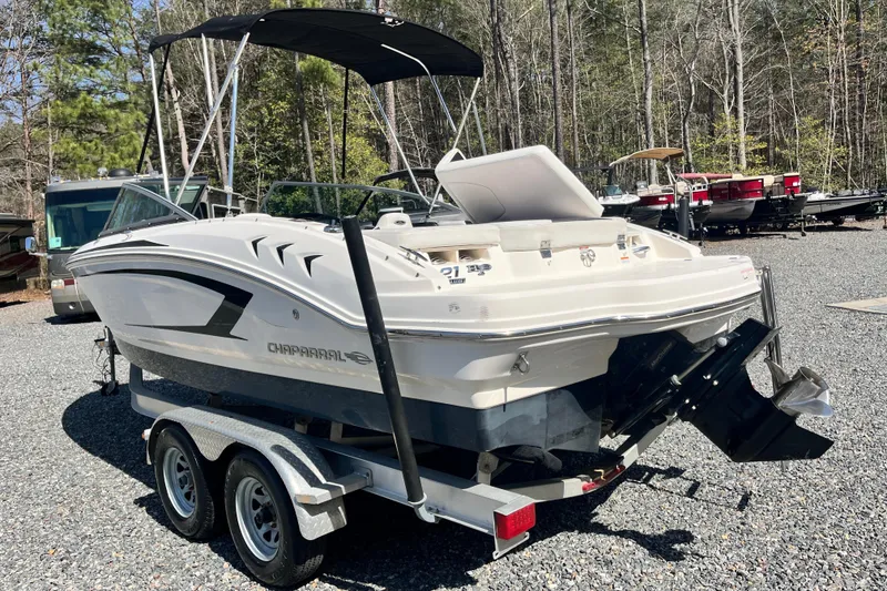 Slide: The Image of 2016 Chaparral 21 H2O Sport boat on trailer, parked outdoors. - 2