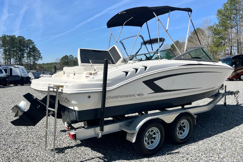 Slide: The Image of 2016 Chaparral 21 H2O Sport boat on trailer, parked outdoors. - 3