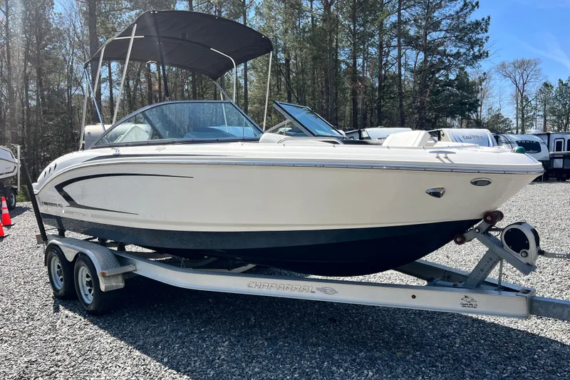 Slide: The Image of 2016 Chaparral 21 H2O Sport boat on trailer, parked outdoors. - 4