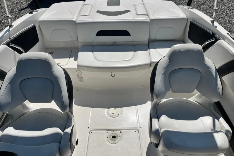Slide: The Image of Interior of 2016 Chaparral 21 H2O Sport boat with white seating and modern design. - 7