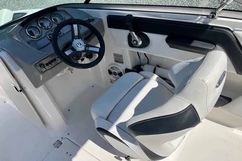 Slide: The Image of Interior view of 2016 Chaparral 21 H2O Sport boat cockpit with steering wheel and controls. - 8