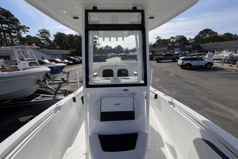 Slide: The Image of 2026 Tidewater 198 CC Adventure boat interior view at a dealership. - 11
