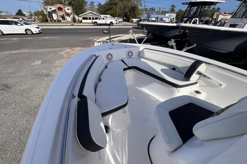 Slide: The Image of 2026 Tidewater 198 CC Adventure boat interior with seating and speakers. - 12