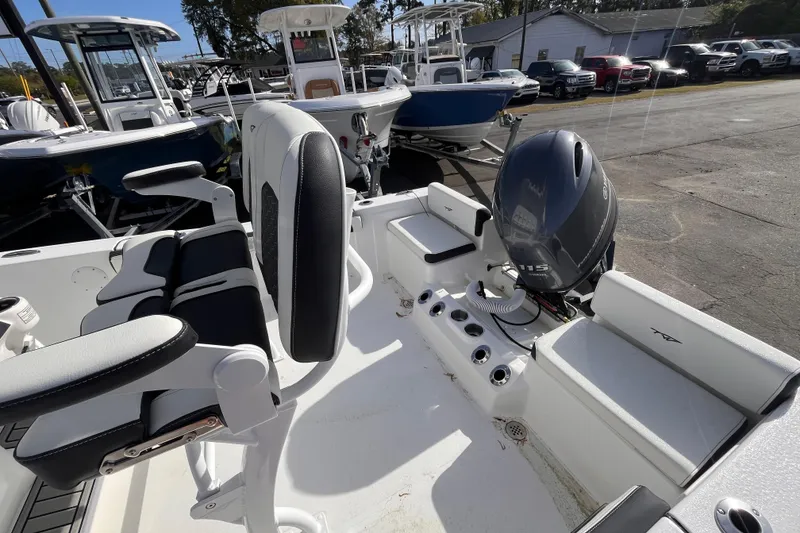 Slide: The Image of 2026 Tidewater 198 CC Adventure boat interior with seating and Yamaha outboard motor. - 16