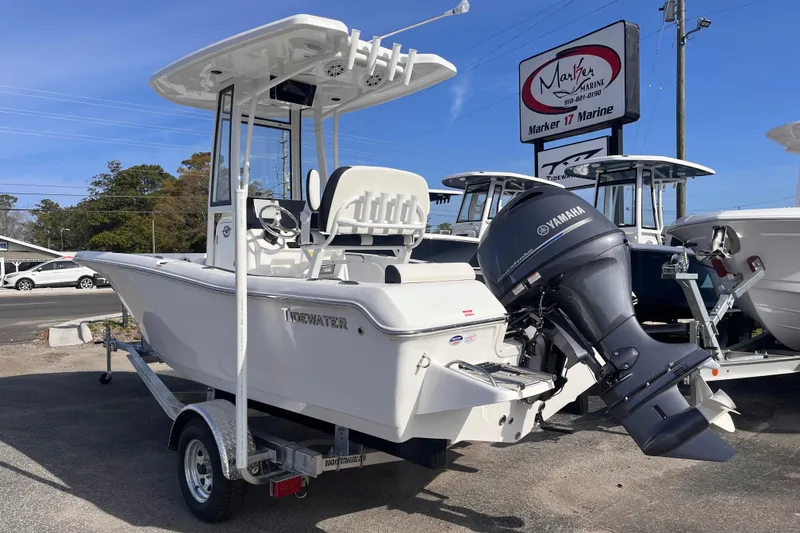 Slide: The Image of 2026 Tidewater 198 CC Adventure boat with Yamaha engine on trailer at dealership. - 2