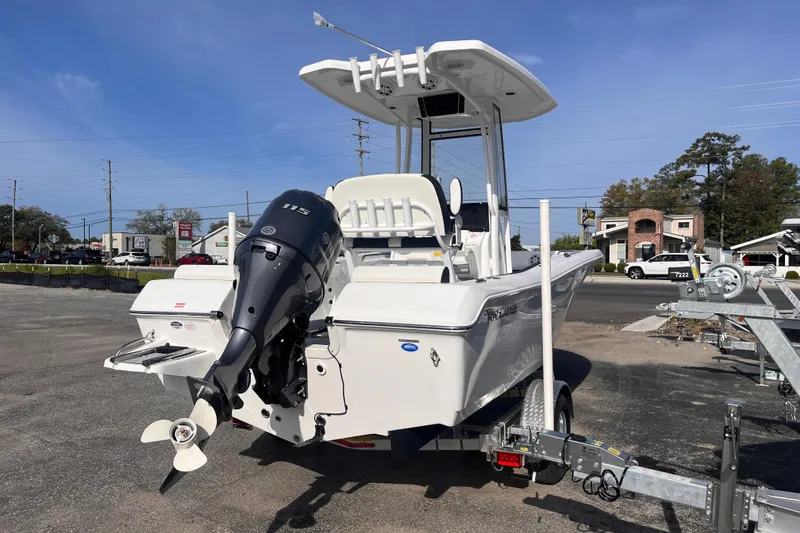 Slide: The Image of 2026 Tidewater 198 CC Adventure boat on trailer, featuring a powerful outboard motor. - 4