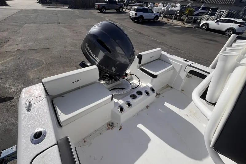 Slide: The Image of 2026 Tidewater 198 CC Adventure boat with Yamaha outboard motor, docked in a marina. - 5