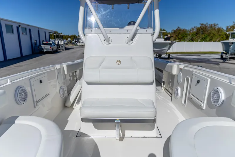 Slide: The Image of 2022 Edgewater 245CC boat interior with seating and storage compartments. - 4