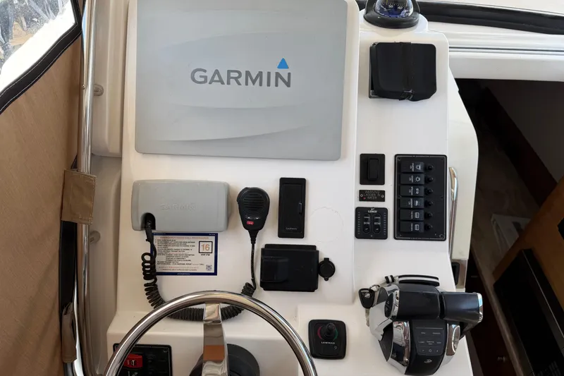 Slide: The Image of Helm of 2015 Belzona 32 Walkaround with Garmin navigation and control panel. - 20