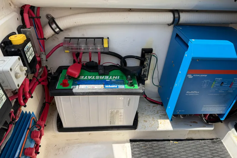 Slide: The Image of Electrical system of a 2015 Belzona 32 Walkaround boat, featuring battery and inverter. - 24