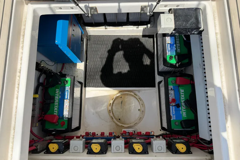 Slide: The Image of 2015 Belzona 32 Walkaround battery compartment with Interstate batteries and electrical components. - 25