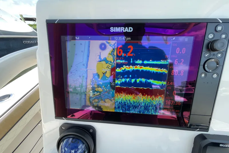 Slide: The Image of Simrad display on 2023 Sea Chaser 24 HFC showing navigation and sonar data. - 17