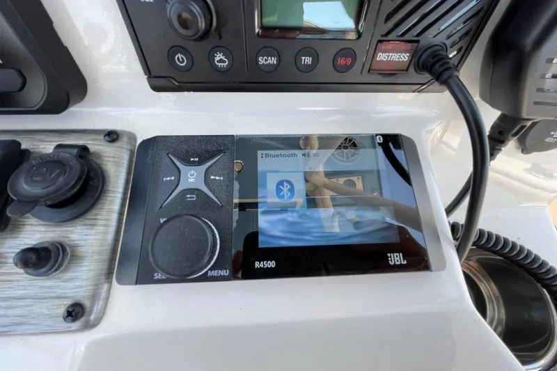 Slide: The Image of Control panel of 2023 Sea Chaser 24 HFC boat with JBL Bluetooth display. - 20