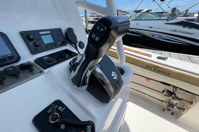 Slide: The Image of 2023 Sea Chaser 24 HFC boat controls with Simrad electronics at dock. - 24