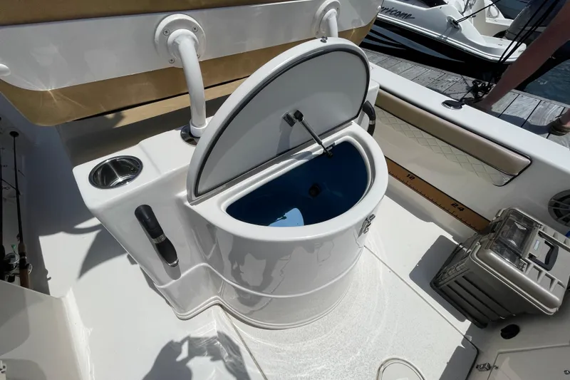 Slide: The Image of 2023 Sea Chaser 24 HFC boat with open livewell and fishing rod holder. - 29