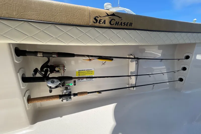 Slide: The Image of 2023 Sea Chaser 24 HFC fishing rod holders with rods on deck. - 39