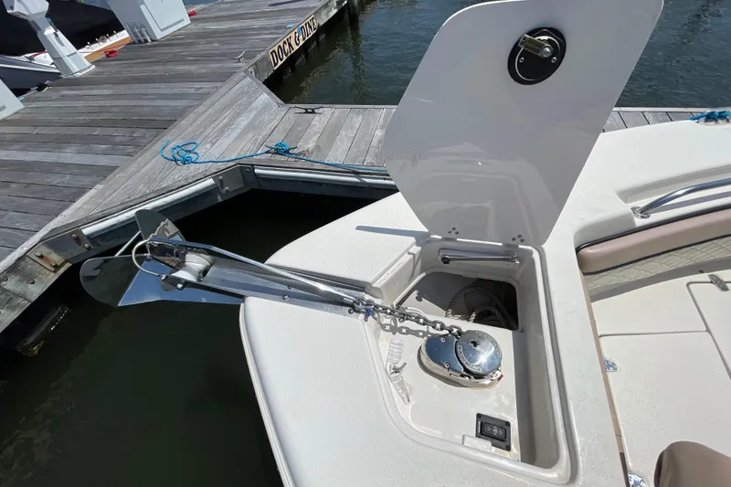 Slide: The Image of 2023 Sea Chaser 24 HFC boat anchor compartment at dockside. - 8