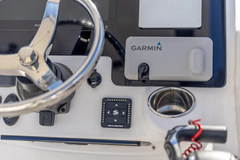 Slide: The Image of Steering console of 2025 Edgewater 248CX Crossover with Garmin navigation system. - 17