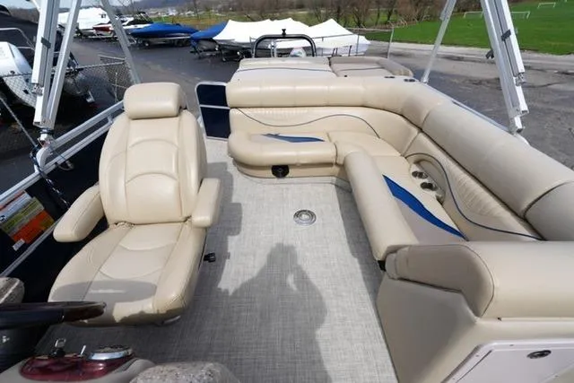 Slide: The Image of 2012 South Bay 722CR pontoon boat with beige seating and spacious deck layout. - 12