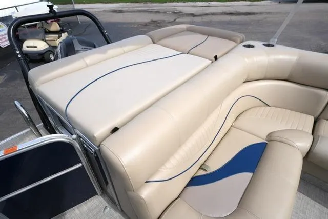 Slide: The Image of Luxurious seating on a 2012 South Bay 722CR pontoon boat with beige upholstery. - 13