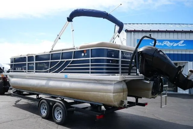 Slide: The Image of 2012 South Bay 722CR pontoon boat on trailer, parked outside dealership. - 7