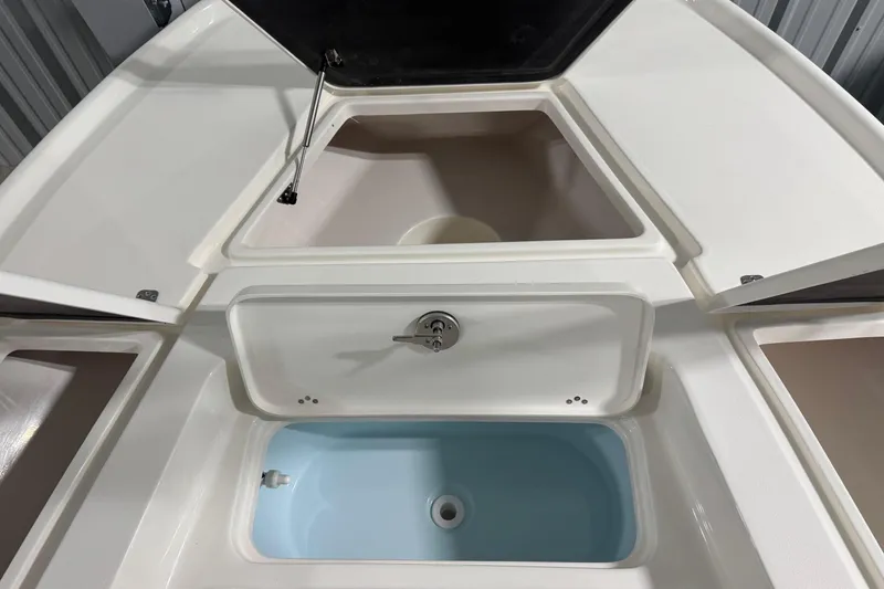 Slide: The Image of 2026 Key West 210 Bay Reef boat storage compartments and livewell. - 14