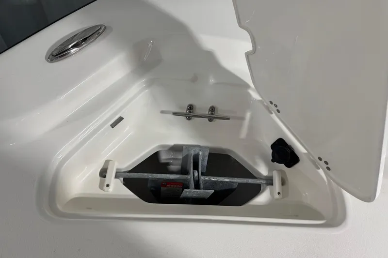 Slide: The Image of Anchor storage compartment on 2026 Key West 210 Bay Reef boat, open lid view. - 16