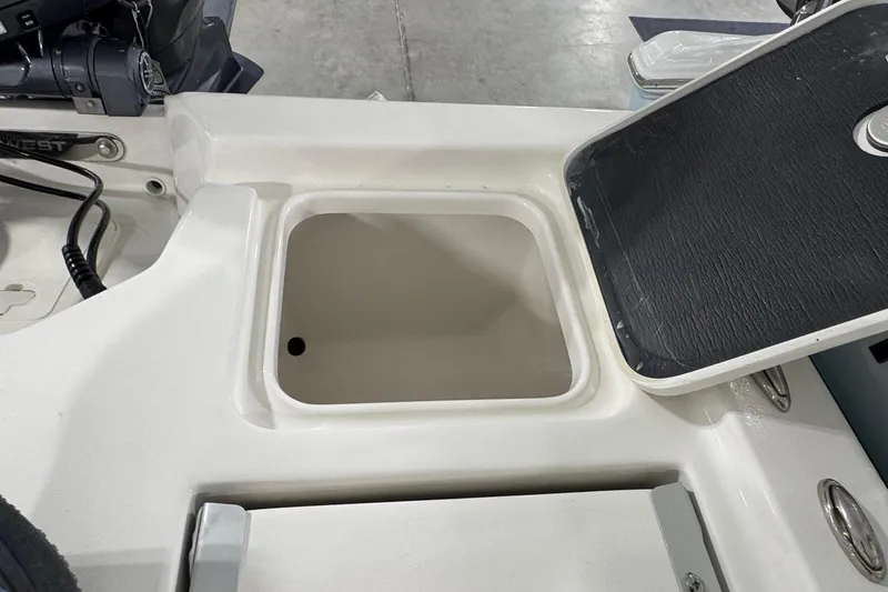 Slide: The Image of Open storage compartment on 2026 Key West 210 Bay Reef boat. - 18