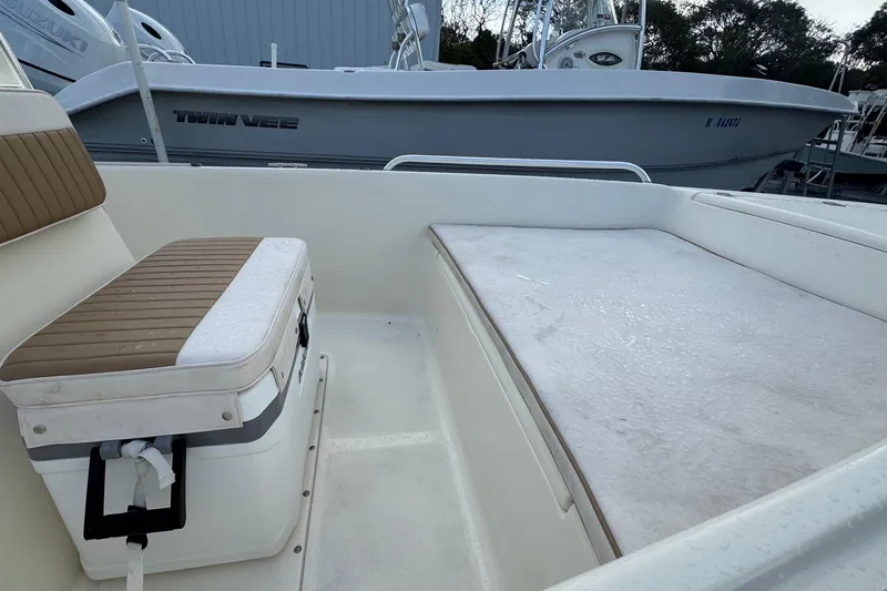 Slide: The Image of 2001 Scout 175 Sportfish boat interior with seating and storage area. - 6