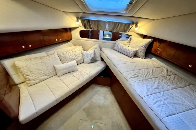Slide: The Image of Luxurious interior cabin of 2003 Sea Ray 390 Motor Yacht with plush seating and elegant decor. - 9