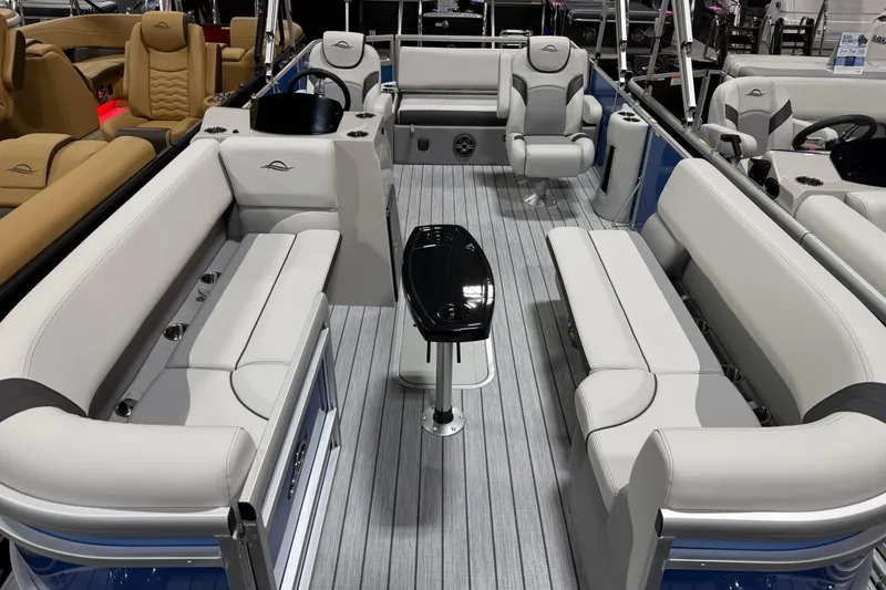 Slide: The Image of Luxurious 2026 SunCatcher Select 322SL pontoon boat interior with plush seating and sleek design. - 2