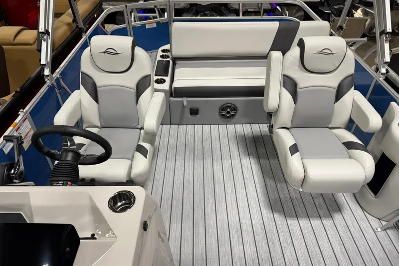 Slide: The Image of 2026 SunCatcher Select 322SL boat interior with plush seating and modern steering console. - 3