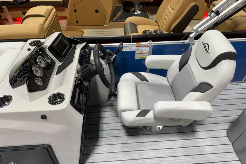 Slide: The Image of Captain's chair and dashboard of 2026 SunCatcher Select 322SL boat. - 4