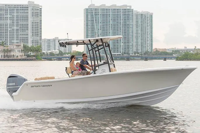 Slide: The Image of 2021 Sportsman Heritage 231 Center Console on water with skyscrapers in background. - 2