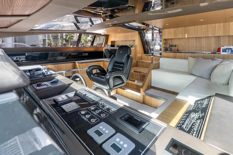 Slide: The Image of Luxurious interior of 2020 Riva 100' Corsaro yacht with modern helm and seating area. - 11