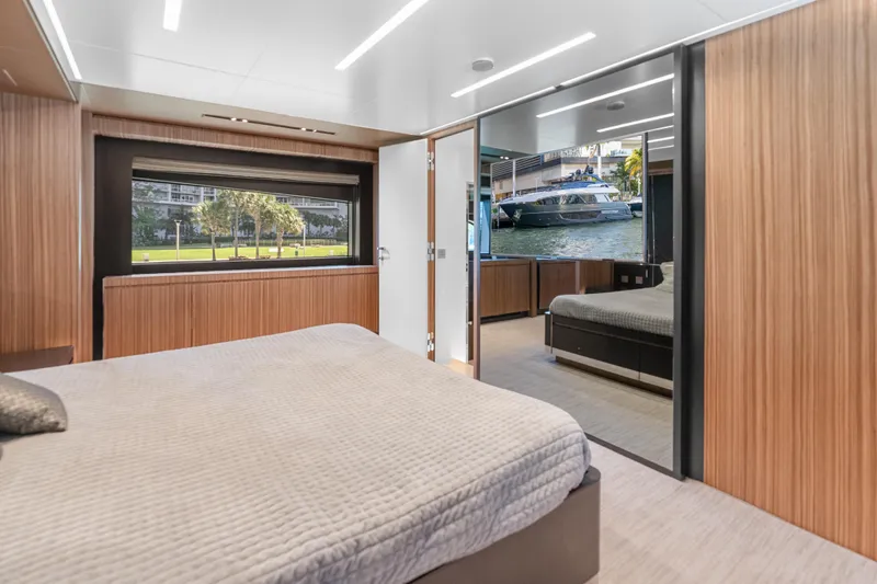 Slide: The Image of Luxurious interior of 2020 Riva 100' Corsaro yacht with modern wood paneling. - 58
