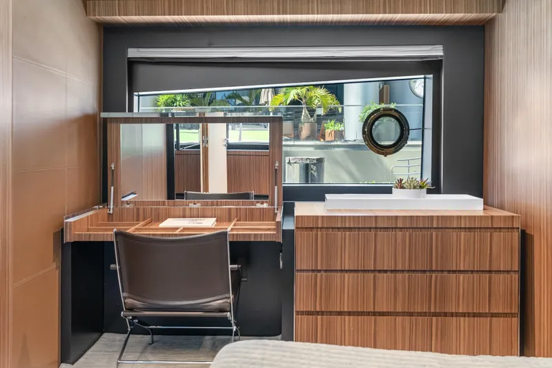 Slide: The Image of Luxurious interior of 2020 Riva 100' Corsaro yacht with elegant wood finish and modern furnishings. - 60