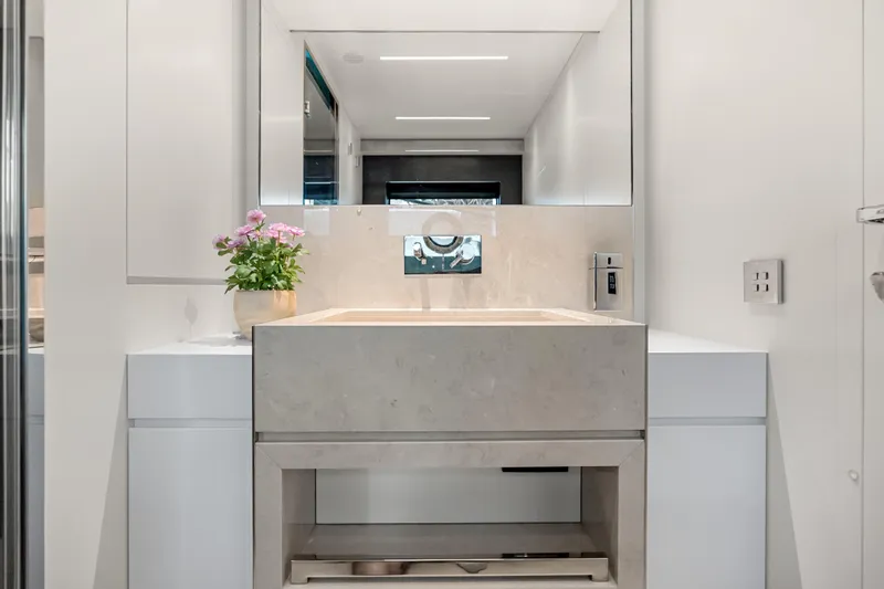 Slide: The Image of Luxurious bathroom interior on 2020 Riva 100' Corsaro yacht, featuring modern sink and elegant decor. - 79