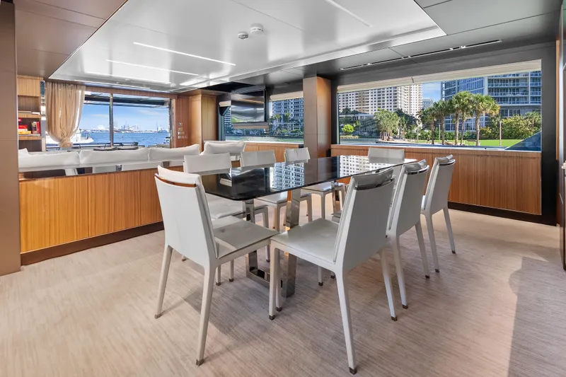 Slide: The Image of Luxurious interior of 2020 Riva 100' Corsaro yacht with elegant dining area and scenic views. - 8