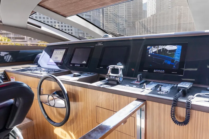 Slide: The Image of Helm of 2020 Riva 100' Corsaro yacht with modern navigation equipment and sleek design. - 89