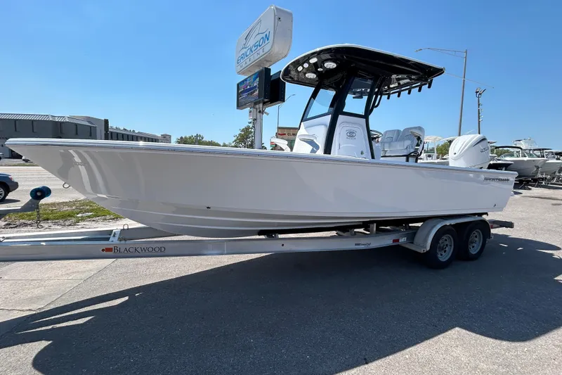 Slide: The Image of 2026 Sportsman Masters 247OE Bay Boat on trailer at dealership. - 10