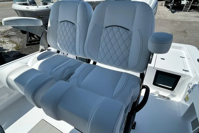 Slide: The Image of Luxurious seating on 2026 Sportsman Masters 247OE Bay Boat, featuring diamond-stitched upholstery. - 19